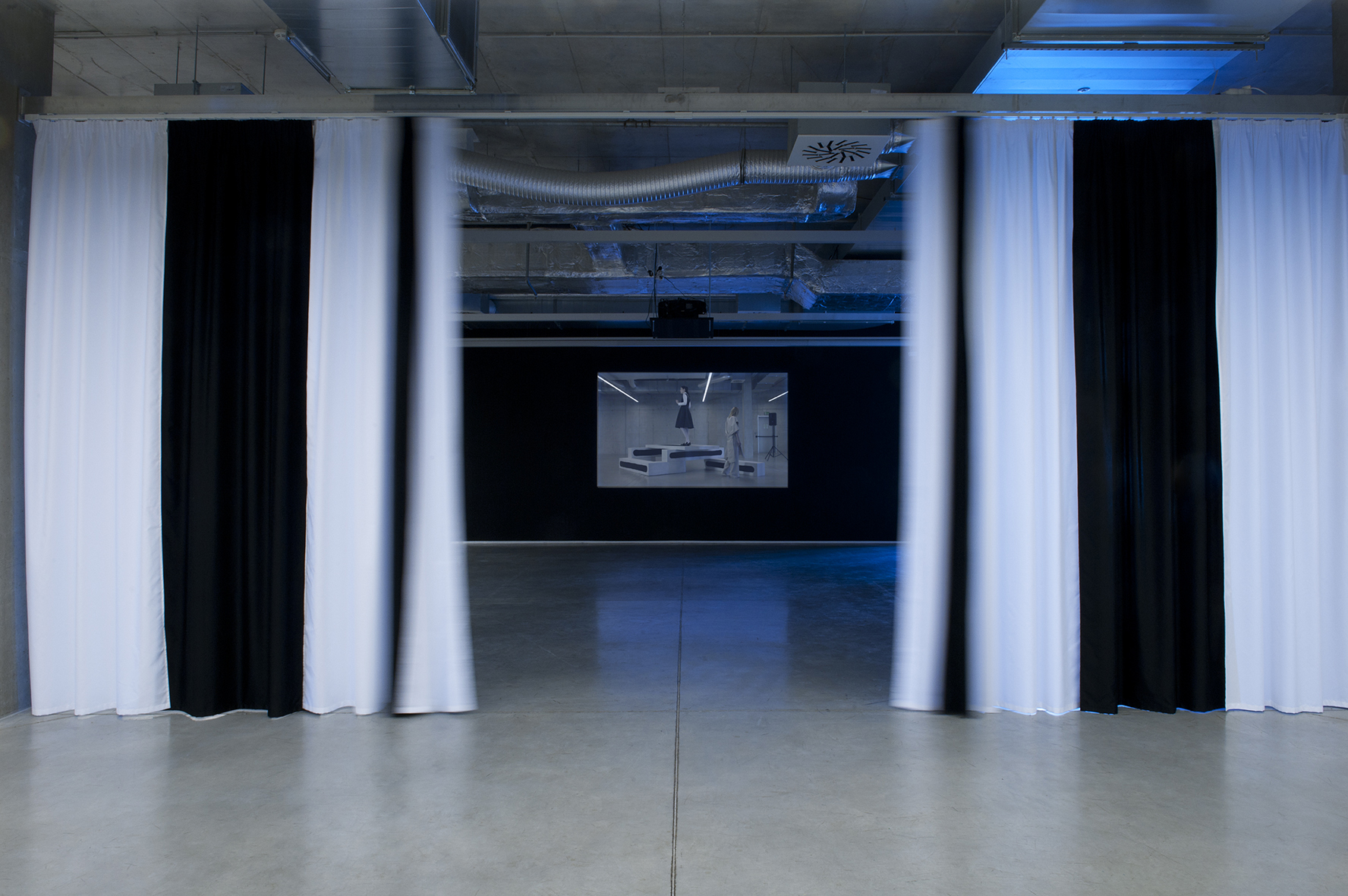 The Exhibition, Rafani groupe, The Curtain, installation, 2010 and Nicholas Riis, Nora Turato, Jana Plodková, Exhibition Guide, HD video, 2015